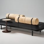 Etta ottoman in black leather and bolster in natural sheepskin